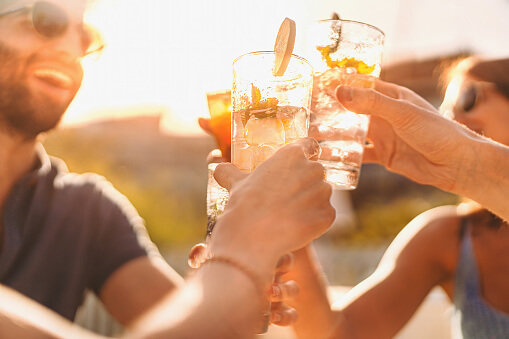 Friends sharing a drink at Seaflower community event